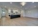 Open concept living area showcasing the kitchen island and ample living space at 4525 Twinberry Dr, Powder Springs, GA 30127