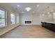 Open-concept living space featuring an electric fireplace at 4525 Twinberry Dr, Powder Springs, GA 30127