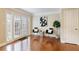 Sunlit living room features hardwood floors, French doors, and stylish décor at 6980 Roswell Rd # G3, Atlanta, GA 30328
