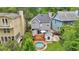 A backyard with a deck, steel pool, and small storage shed, with a modern home at 120 Candler Oaks Ln, Decatur, GA 30030