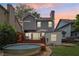 A backyard with a deck, steel pool, and modern home with a patio at 120 Candler Oaks Ln, Decatur, GA 30030