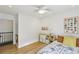 Comfortable bedroom featuring a ceiling fan, light wood floors, and cheerful decor at 120 Candler Oaks Ln, Decatur, GA 30030