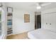 Bright bedroom with built-in shelving and a ceiling fan; showcasing a comfortable and inviting space at 120 Candler Oaks Ln, Decatur, GA 30030
