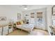 Inviting bedroom featuring built-in shelves, a ceiling fan, and cozy decor at 120 Candler Oaks Ln, Decatur, GA 30030