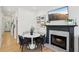 Cozy dining area with built-in seating, fireplace, and television at 120 Candler Oaks Ln, Decatur, GA 30030