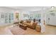Inviting living room with hardwood floors, plantation shutters, and a comfortable leather sofa at 120 Candler Oaks Ln, Decatur, GA 30030