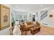 Bright living room with hardwood floors, plantation shutters, and a stylish leather sofa at 120 Candler Oaks Ln, Decatur, GA 30030