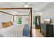A bedroom featuring a four-poster bed and a ceiling fan, blending style and comfort for a relaxing atmosphere at 120 Candler Oaks Ln, Decatur, GA 30030