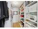 Bright walk-in closet offers ample storage space with built-in shelving and hanging rods at 120 Candler Oaks Ln, Decatur, GA 30030