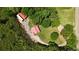 Overhead view of secluded home with a metal roof, outbuilding, and surrounded by dense woods at 154 Knucklesville Rd, Rydal, GA 30171