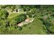 Aerial view of a quaint home nestled among lush greenery and mature trees, perfect for private living at 154 Knucklesville Rd, Rydal, GA 30171