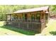 Inviting cabin exterior featuring a covered porch perfect for relaxing and enjoying the surrounding nature at 154 Knucklesville Rd, Rydal, GA 30171