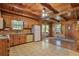 Traditional eat-in kitchen with wood cabinets and vintage appliances at 154 Knucklesville Rd, Rydal, GA 30171