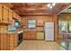 Traditional kitchen with wood cabinets and vintage appliances at 154 Knucklesville Rd, Rydal, GA 30171