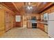 Traditional eat-in kitchen with wood cabinets and vintage appliances at 154 Knucklesville Rd, Rydal, GA 30171