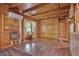 Charming living area with wood paneling, hardwood floors, and natural light creates a warm, inviting atmosphere at 154 Knucklesville Rd, Rydal, GA 30171