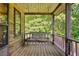 Cozy porch with a swing, perfect for relaxing and enjoying the tranquility of the surrounding nature at 154 Knucklesville Rd, Rydal, GA 30171