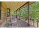 Spacious porch with rocking chairs offers a peaceful spot to unwind and enjoy nature's beauty at 154 Knucklesville Rd, Rydal, GA 30171