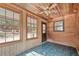 Bright sunroom with multiple windows and a tile floor at 154 Knucklesville Rd, Rydal, GA 30171