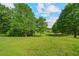 Expansive backyard with lush greenery, offering plenty of space for outdoor activities and relaxation at 154 Knucklesville Rd, Rydal, GA 30171