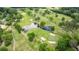Scenic aerial view highlighting a golf course with pristine greens, water features, and lush trees at 1740 Doncaster Ne Dr, Atlanta, GA 30309