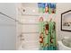 Bathroom with a bathtub, shower with decorative tile, and fun monkey shower curtain at 1740 Doncaster Ne Dr, Atlanta, GA 30309