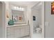 Well-lit bathroom features a marble vanity, decorative mirror, and a separate toilet area at 1740 Doncaster Ne Dr, Atlanta, GA 30309