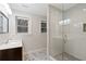 Updated bathroom featuring a glass enclosed shower and a marble vanity at 1740 Doncaster Ne Dr, Atlanta, GA 30309