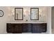 Bathroom featuring double sinks, vanity, and large mirrors at 1740 Doncaster Ne Dr, Atlanta, GA 30309