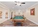 Finished billiard room with a billiard table, wet bar, and light wood floor at 1740 Doncaster Ne Dr, Atlanta, GA 30309