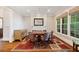 Formal dining room with ample natural light, hardwood floors, and a decorative rug at 1740 Doncaster Ne Dr, Atlanta, GA 30309