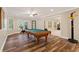 Finished game room with a billiard table, exercise bike, and a basketball hoop at 1740 Doncaster Ne Dr, Atlanta, GA 30309