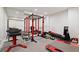 Home gym featuring weightlifting equipment and mirrored wall at 1740 Doncaster Ne Dr, Atlanta, GA 30309