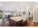 Open-concept kitchen with granite countertops, stainless steel appliances, and hardwood floors at 1740 Doncaster Ne Dr, Atlanta, GA 30309