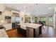 Well-equipped kitchen with a large island, stainless steel appliances, and adjacent dining area at 1740 Doncaster Ne Dr, Atlanta, GA 30309