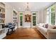 Bright living room boasts built-in bookshelves, hardwood floors, and plenty of natural light at 1740 Doncaster Ne Dr, Atlanta, GA 30309