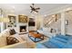 Spacious living room with fireplace, built-ins, hardwood floors, and a view of the staircase at 1740 Doncaster Ne Dr, Atlanta, GA 30309