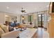 Open living room featuring hardwood floors, fireplace, and french doors leading to a balcony at 1740 Doncaster Ne Dr, Atlanta, GA 30309