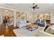 Open living room showcasing hardwood floors, a staircase, and seamless access to the dining area at 1740 Doncaster Ne Dr, Atlanta, GA 30309
