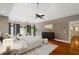Spacious main bedroom with hardwood floors, tray ceiling, a sitting area, and large windows at 1740 Doncaster Ne Dr, Atlanta, GA 30309