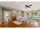 Spacious main bedroom with hardwood floors, trey ceiling, fan, and a chandelier at 1740 Doncaster Ne Dr, Atlanta, GA 30309
