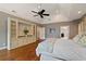 Large main bedroom with hardwood floors, built-in shelving, trey ceiling, and good lighting at 1740 Doncaster Ne Dr, Atlanta, GA 30309