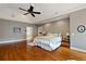 Large main bedroom with hardwood floors, trey ceiling, ensuite bathroom, and good lighting at 1740 Doncaster Ne Dr, Atlanta, GA 30309