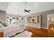 Large main bedroom with hardwood floors, built-in shelving, trey ceiling, and natural light at 1740 Doncaster Ne Dr, Atlanta, GA 30309