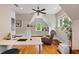 Bright office space featuring hardwood floors, built-in shelving, and lots of natural light from the window at 1740 Doncaster Ne Dr, Atlanta, GA 30309