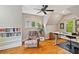 Bright home office with built-in bookshelves, hardwood floors, and a comfortable chair at 1740 Doncaster Ne Dr, Atlanta, GA 30309