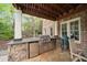 Outdoor kitchen and built-in grill with stone design at 1740 Doncaster Ne Dr, Atlanta, GA 30309