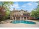 Beautiful backyard pool and spa with brick home and screened-in porch at 1740 Doncaster Ne Dr, Atlanta, GA 30309