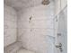 Modern tile shower with rain shower head, shower head and bench seating at 1740 Doncaster Ne Dr, Atlanta, GA 30309