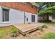 View of backyard deck and cinderblock foundation of home, providing a cozy outdoor space and easy access at 339 Diane Se Dr, Smyrna, GA 30082
